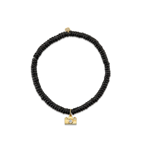 Gold & Diamond Camera On Black Spinel