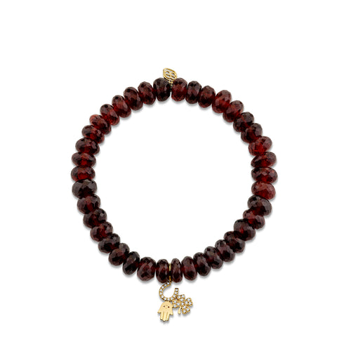 Gold & Diamond Luck and Protection Charm on Garnet