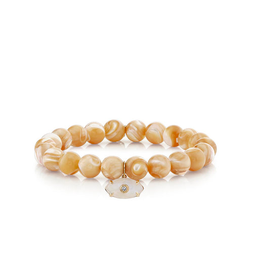 Gold & Diamond Carved Stone Eye on Tan Mother of Pearl