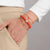 Gold, Diamond & Enamel Round Eye Bead on Peach Coral