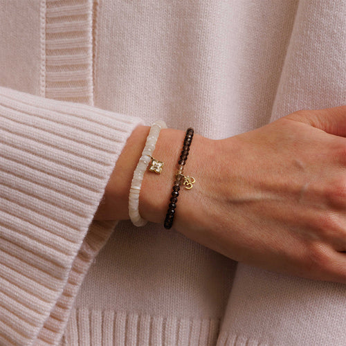 Pure Gold Tiny Om Charm on Shaded Smokey Quartz