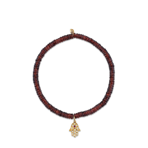 Gold & Diamond Hamsa on Garnet